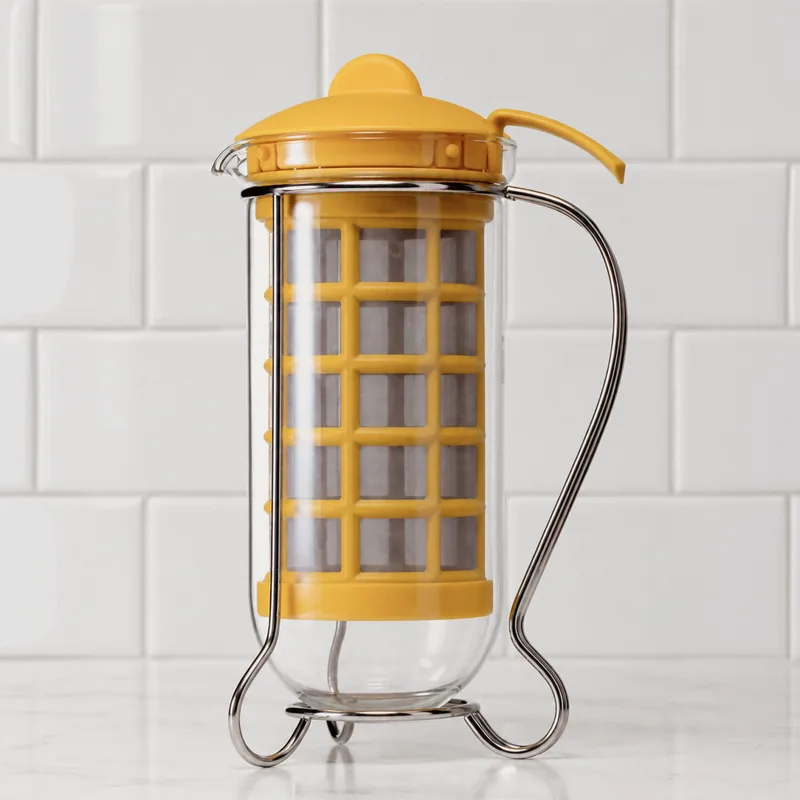 Mono Cafino with a yellow filter, glass body, and wire frame